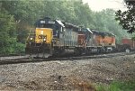 Eastbound manifest departs on a gloomy afternoon